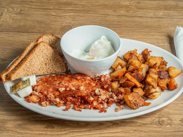 2 Eggs Your Way w/Home Fries or Beans & Choice of Toast or Biscuit.